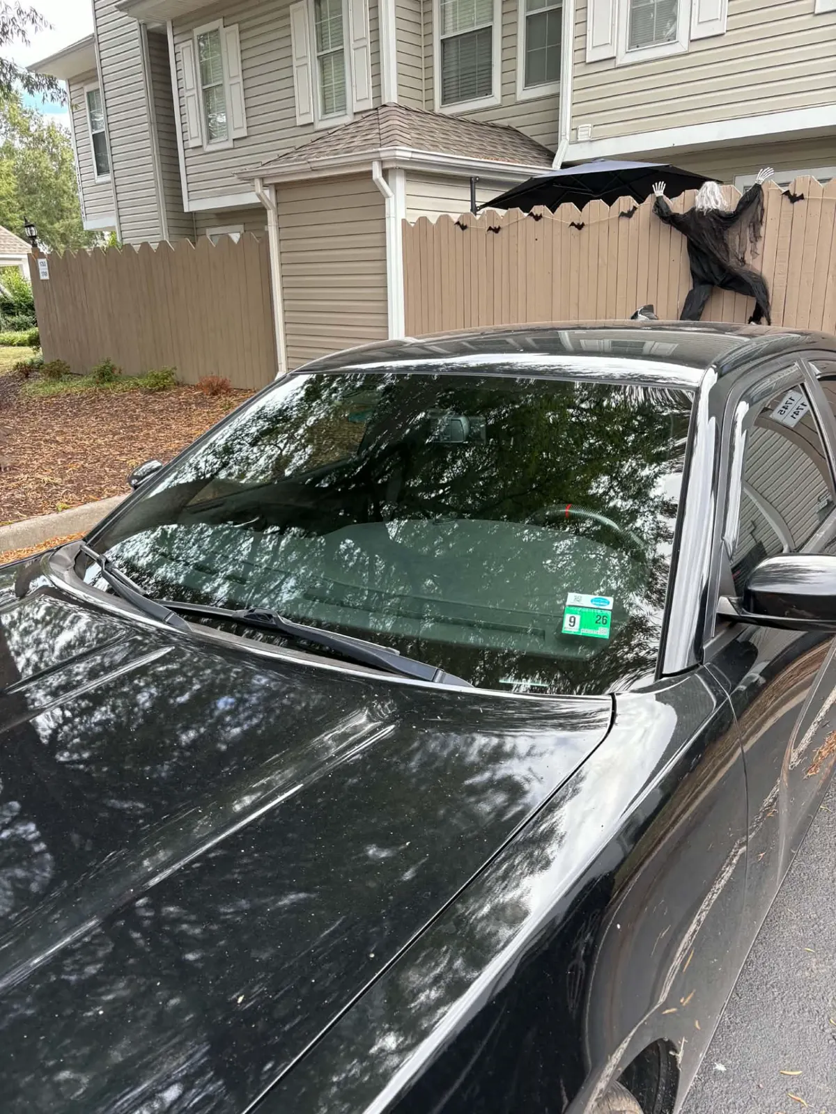 Black sedan with a newly installed windshield in Norfolk